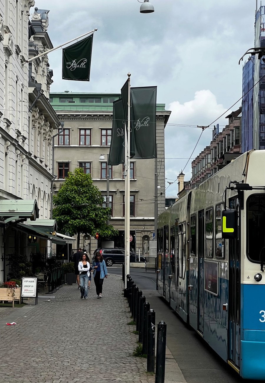 A Gothenburg tram on a cobbled city street