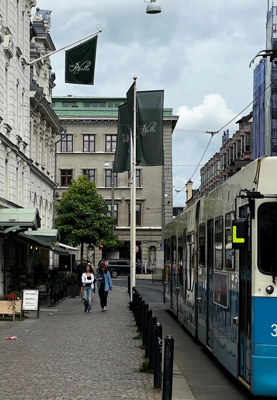 A Gothenburg tram on a cobbled city street